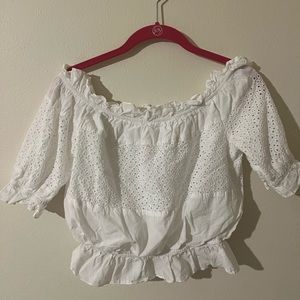 Size S white cropped blouse. Brand new could also fit an XS or M. Never worn.